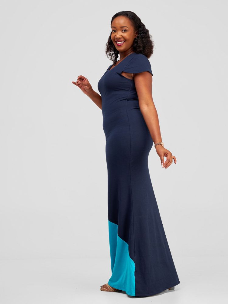 chic sleeveless maxi dress, featuring an elegant rounded neckline, double-layered construction, and a bold color-block panel at the bottom.