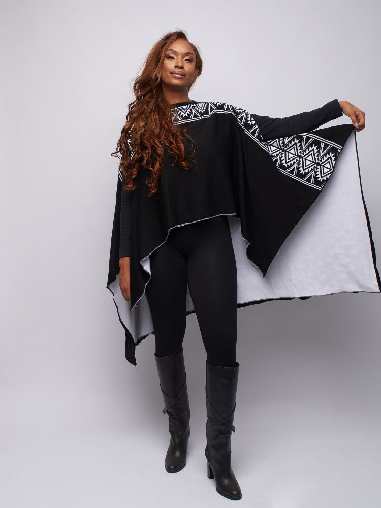  double-layered knit poncho with a rounded neckline, 
