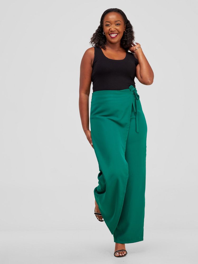 Featuring an attached front overlap that can be stylishly tied at the side, this piece boasts an elasticized back waistband for a perfect fit.