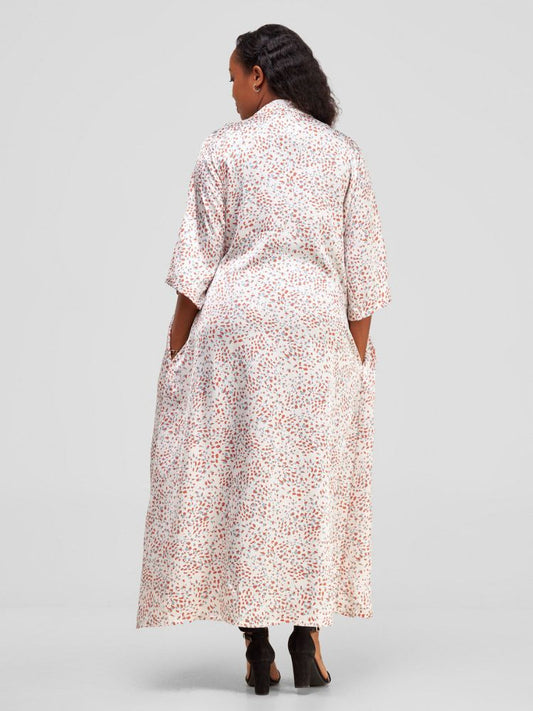 The kimono's loose fit drapes the silhouette with subtle sophistication
