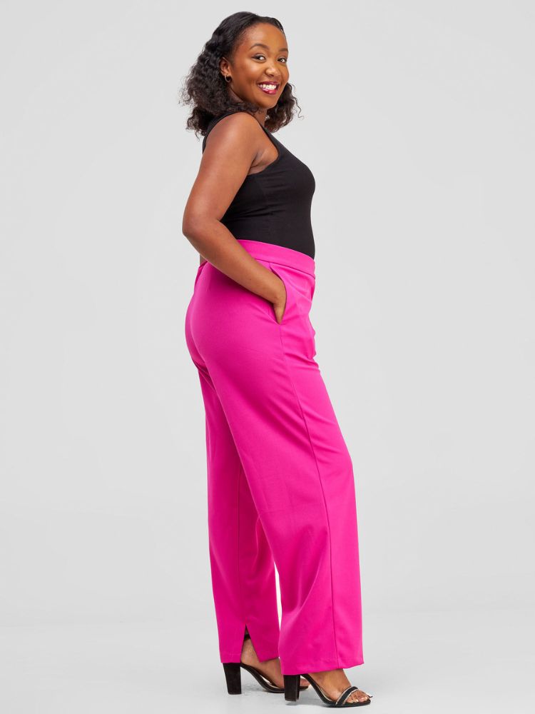 High-waisted pants with a classic front fly, elegantly finished with a sleek slit detail at the hem.