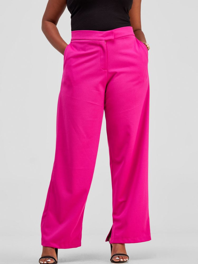 High-waisted pants with a classic front fly, elegantly finished with a sleek slit detail at the hem.