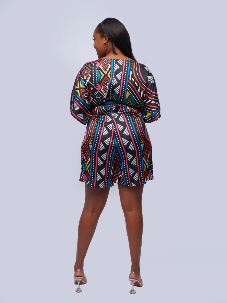 This playsuit boasts a unique design with kimono sleeves and a loose-fitting top.