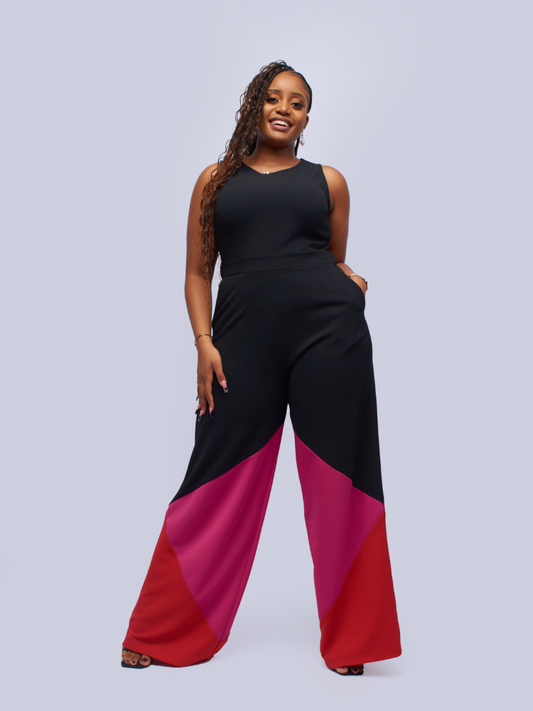 sleeveless jumpsuit features a rounded neckline and wide-leg bottoms for a trendy look
