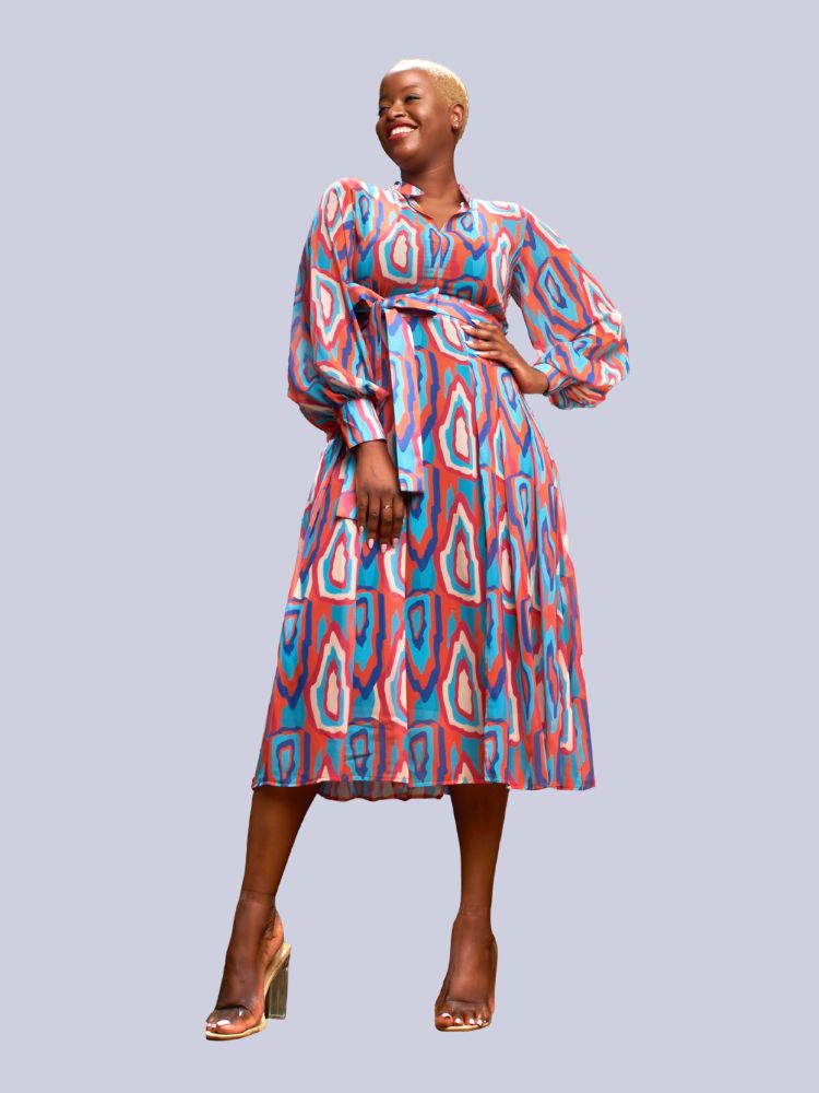 This midi dress is designed with long sleeves and a v-neckline. 