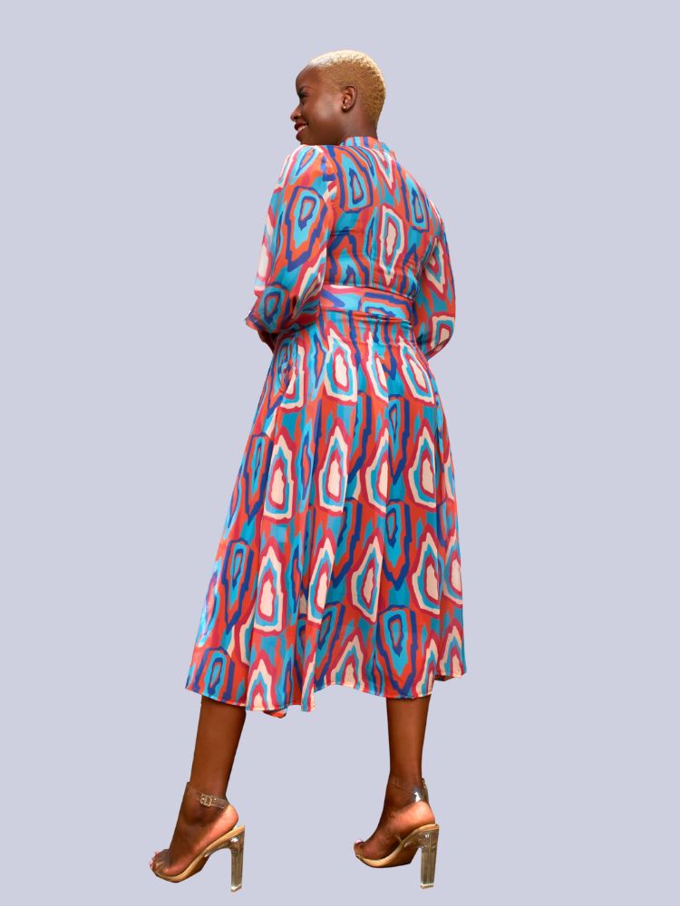 This midi dress is designed with long sleeves and a v-neckline. 