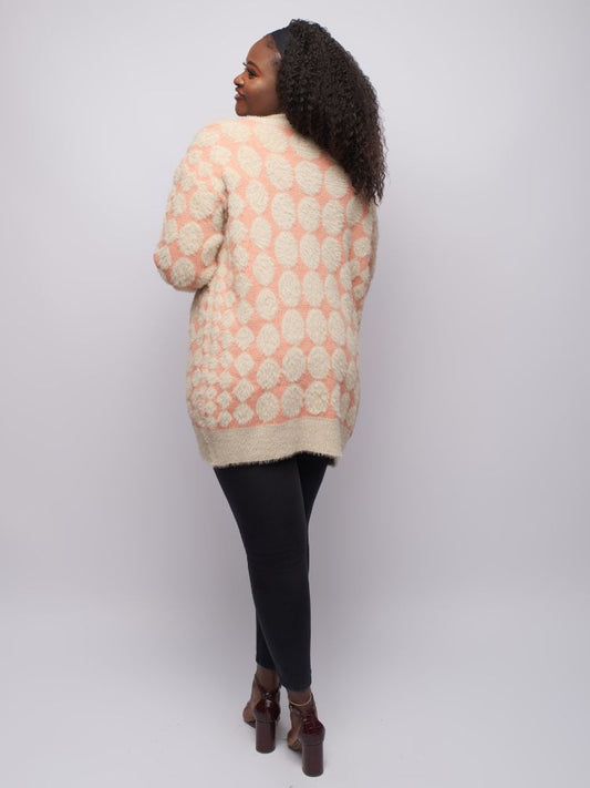 Cozy up in this fur-like diamond print cardigan with long sleeves and snug wrist stitching.